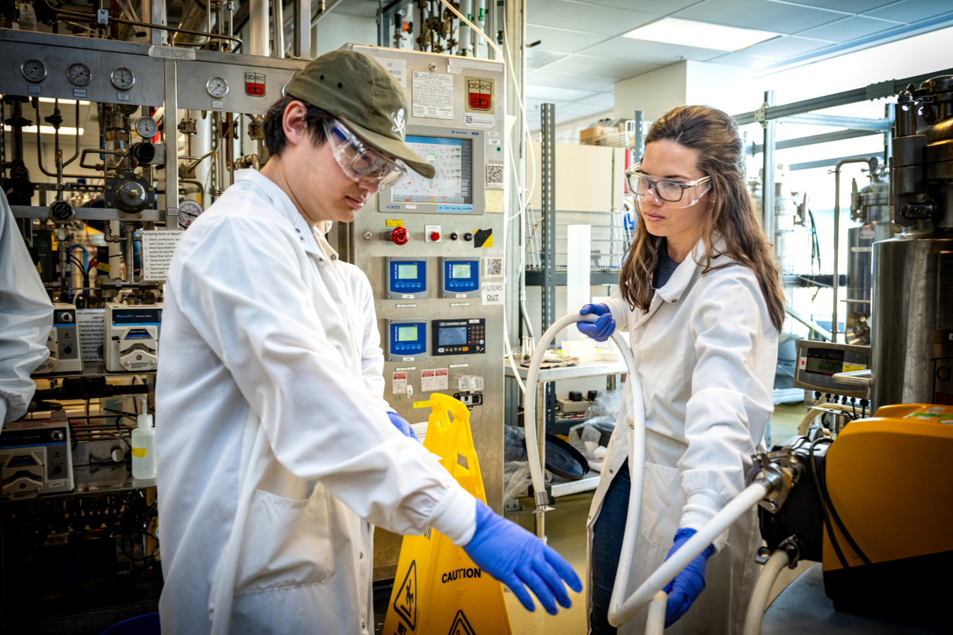 Pictured: Laura Fernandez, right, interacts with students in the Advanced Bioprocess Engineering Laboratory course.